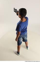 TIMBO STANDING POSE WITH GUN